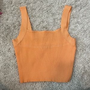 orange knit top
